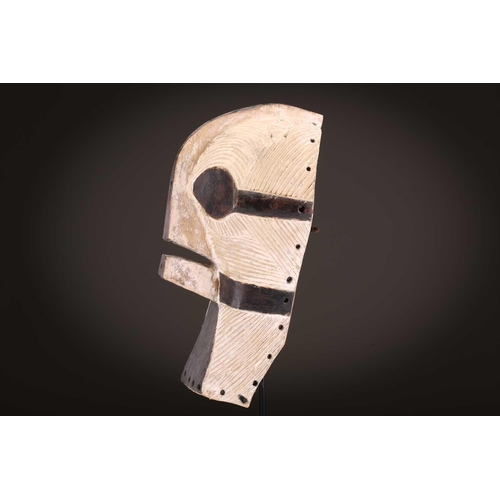 89 - A Songye Kikashi kifwebe, Democratic Republic of Congo, with fine incised linear carving and protrud... 