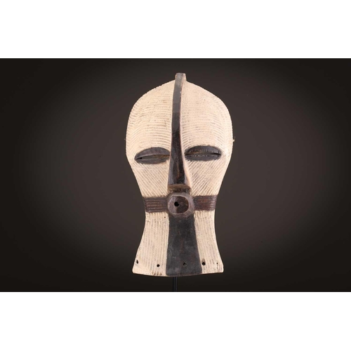 89 - A Songye Kikashi kifwebe, Democratic Republic of Congo, with fine incised linear carving and protrud... 