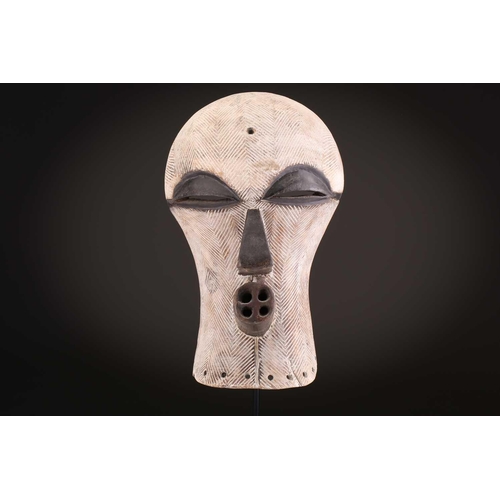 90 - Two Songye/Luba female Bifwebe masks, Bikashi, each with fine linear decoration, the eyes, nose and ... 