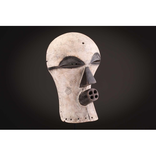 90 - Two Songye/Luba female Bifwebe masks, Bikashi, each with fine linear decoration, the eyes, nose and ... 