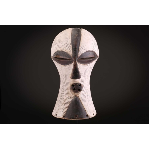 90 - Two Songye/Luba female Bifwebe masks, Bikashi, each with fine linear decoration, the eyes, nose and ... 