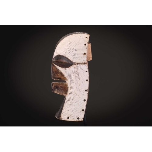 90 - Two Songye/Luba female Bifwebe masks, Bikashi, each with fine linear decoration, the eyes, nose and ... 