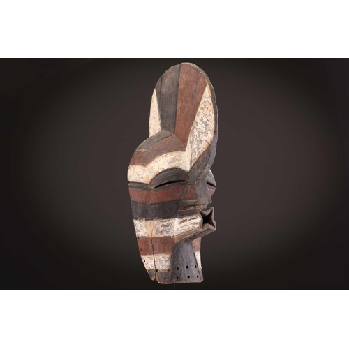 91 - Two Songye kifwebe, Democratic Republic of Congo, the male mask with a tall crest, with butterfly sh... 