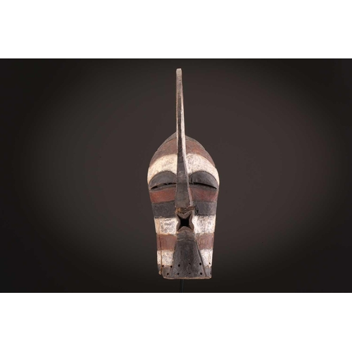 91 - Two Songye kifwebe, Democratic Republic of Congo, the male mask with a tall crest, with butterfly sh... 