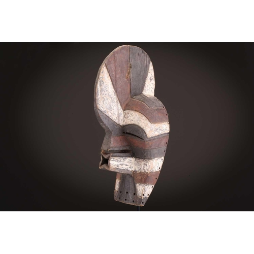 91 - Two Songye kifwebe, Democratic Republic of Congo, the male mask with a tall crest, with butterfly sh... 