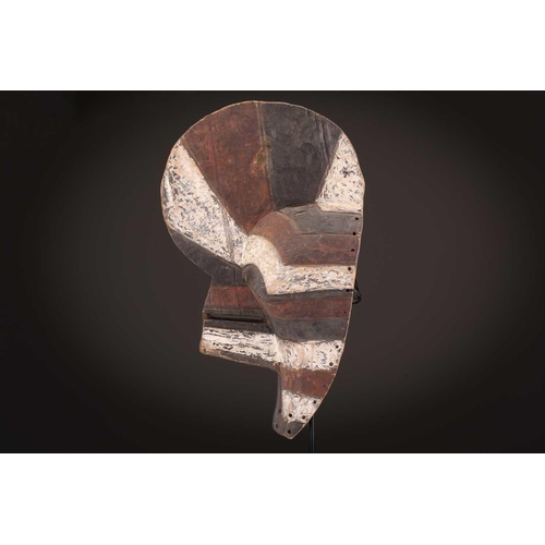 91 - Two Songye kifwebe, Democratic Republic of Congo, the male mask with a tall crest, with butterfly sh... 