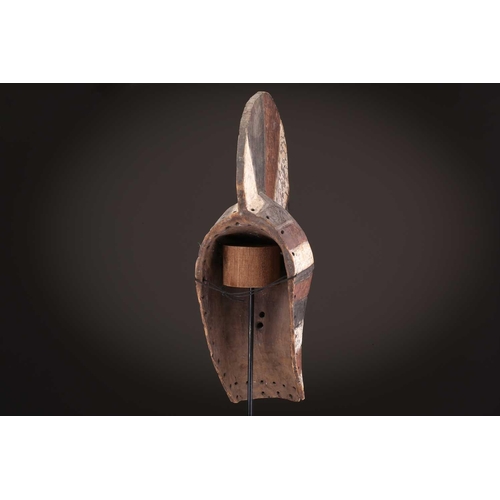 91 - Two Songye kifwebe, Democratic Republic of Congo, the male mask with a tall crest, with butterfly sh... 