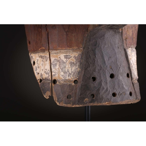 91 - Two Songye kifwebe, Democratic Republic of Congo, the male mask with a tall crest, with butterfly sh... 