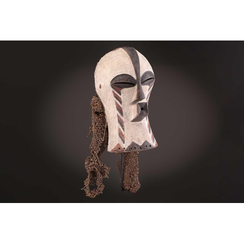 91 - Two Songye kifwebe, Democratic Republic of Congo, the male mask with a tall crest, with butterfly sh... 