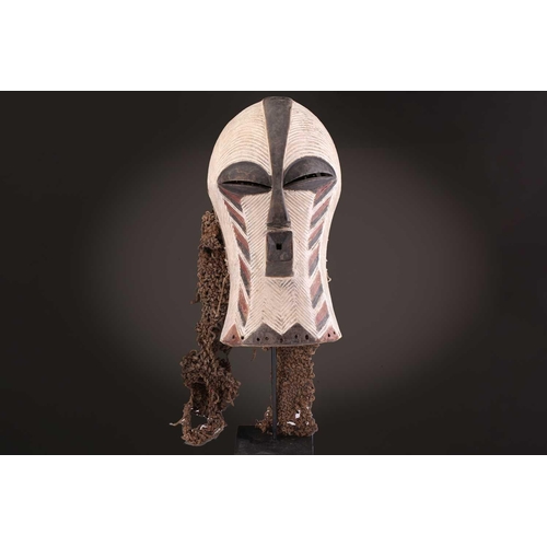 91 - Two Songye kifwebe, Democratic Republic of Congo, the male mask with a tall crest, with butterfly sh... 