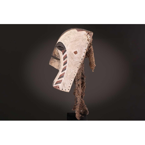 91 - Two Songye kifwebe, Democratic Republic of Congo, the male mask with a tall crest, with butterfly sh... 