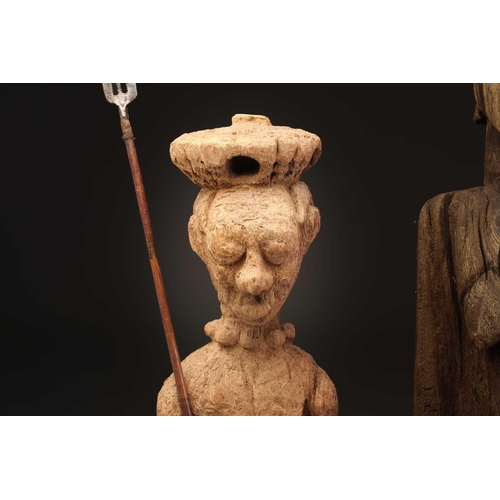 92 - An Indonesian standing female figure, the linear coiffure terminating in a curl, on a wood base, and... 