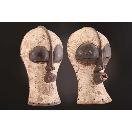 94 - Two Songye Bilume Kifwebe, Democratic Republic of Congo, each with a short pointed crest and oversiz... 