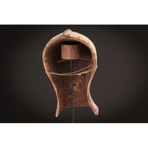 94 - Two Songye Bilume Kifwebe, Democratic Republic of Congo, each with a short pointed crest and oversiz... 