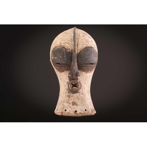 94 - Two Songye Bilume Kifwebe, Democratic Republic of Congo, each with a short pointed crest and oversiz... 
