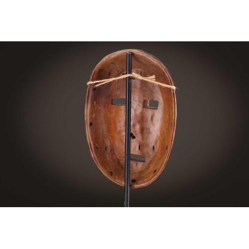 96 - A group of five Lega Idimu masks, Democratic Republic of Congo, painted white with pierced sides, to... 