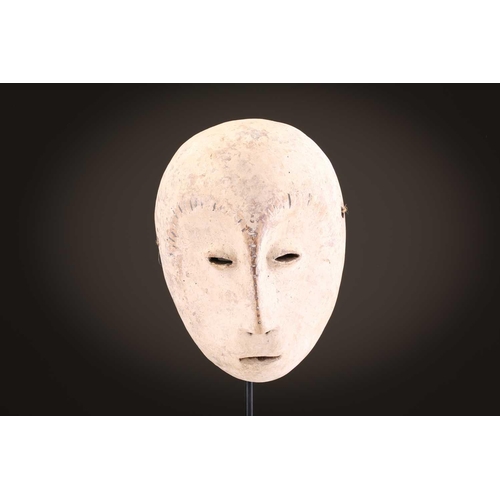 96 - A group of five Lega Idimu masks, Democratic Republic of Congo, painted white with pierced sides, to... 