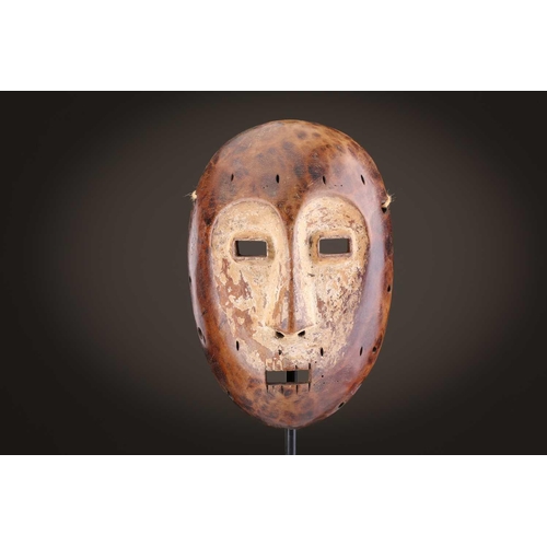 96 - A group of five Lega Idimu masks, Democratic Republic of Congo, painted white with pierced sides, to... 