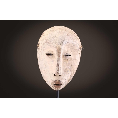 96 - A group of five Lega Idimu masks, Democratic Republic of Congo, painted white with pierced sides, to... 