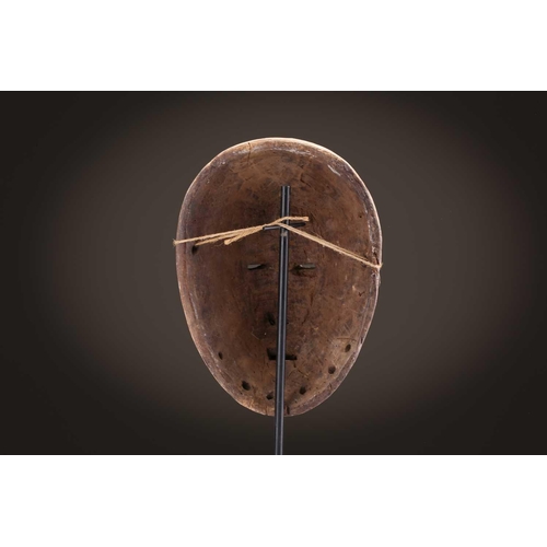 96 - A group of five Lega Idimu masks, Democratic Republic of Congo, painted white with pierced sides, to... 