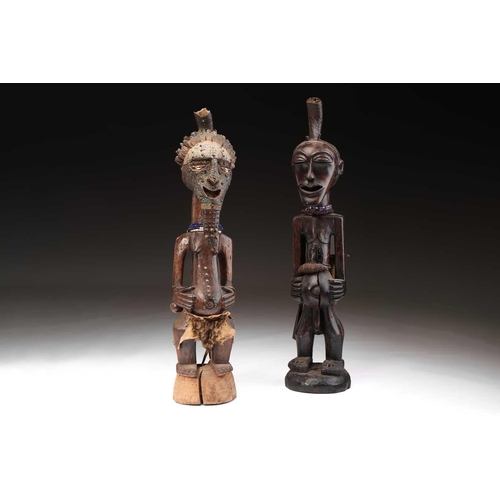 97 - A Songye standing male power figure, Nikisi, Democratic Republic of Congo, with horn charge with ins... 