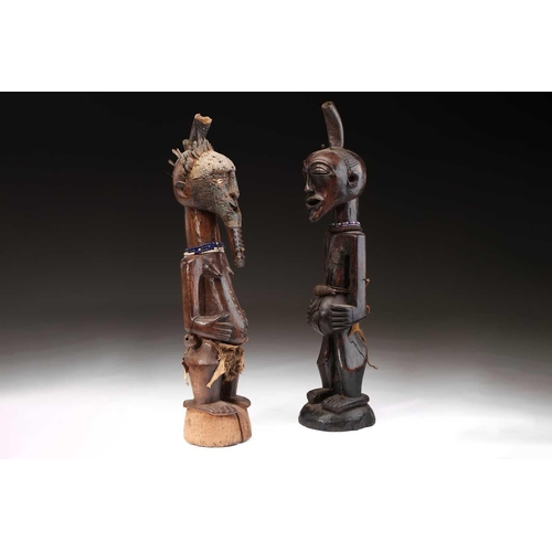 97 - A Songye standing male power figure, Nikisi, Democratic Republic of Congo, with horn charge with ins... 