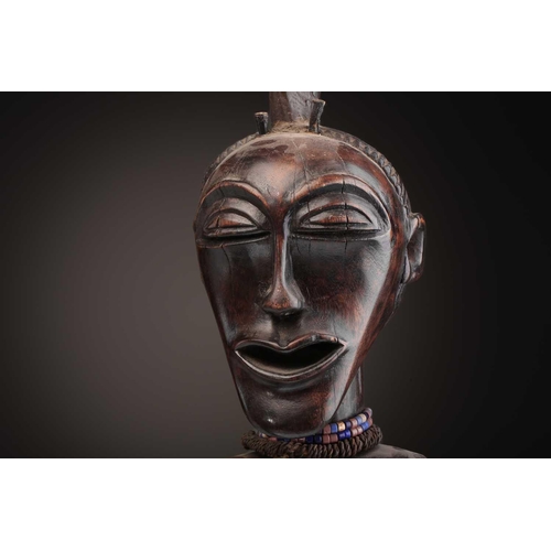 97 - A Songye standing male power figure, Nikisi, Democratic Republic of Congo, with horn charge with ins... 