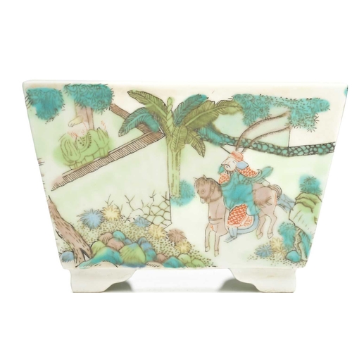 103 - A Chinese porcelain scholars desk accessory, painted in a famille verte palette, each side with figu... 