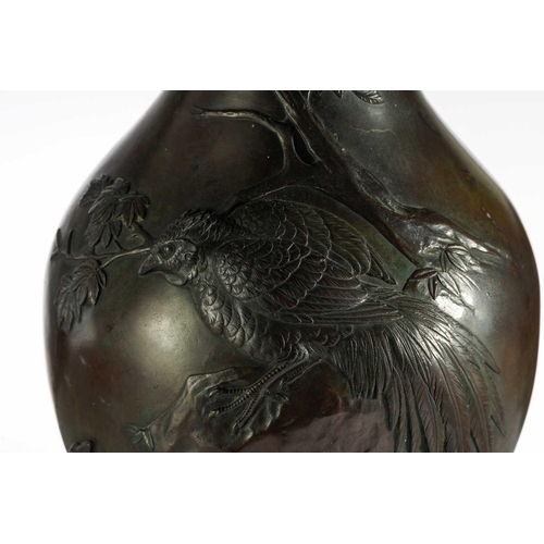 109 - A large Japanese bronze vase, Meiji period, relief decorated with a hawk eyeing a bird from above a ... 