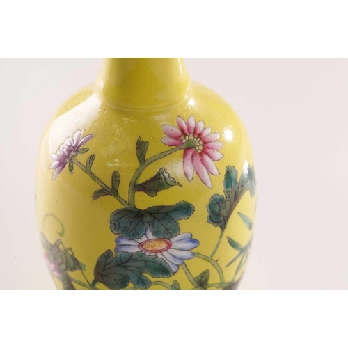 111 - A pair of small Chinese yellow ground vases, ya yu tang, decorated with flowering blooms and butterf... 