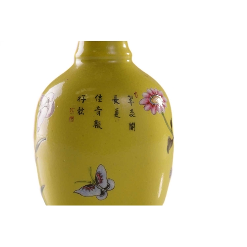 111 - A pair of small Chinese yellow ground vases, ya yu tang, decorated with flowering blooms and butterf... 