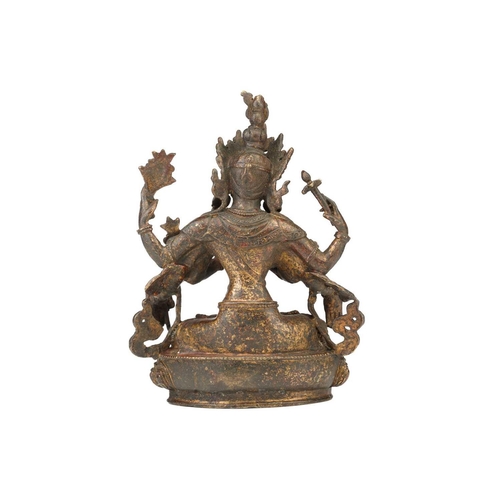 115 - A Chinese Sino Tibetan style bronze Tara, seated in dhyanasana, the six arms with attributes, traces... 