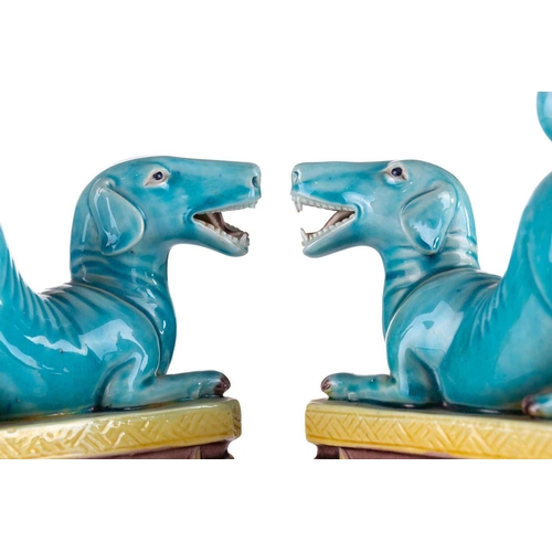 184 - A pair of Chinese torquoise glazed dogs, Qing 19th century, modelled baying with open mouth showing ... 