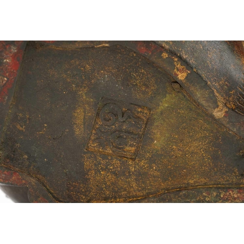 187 - A Chinese bronze censor in the form of a seated temple lion, the removable head forming the cover, w... 