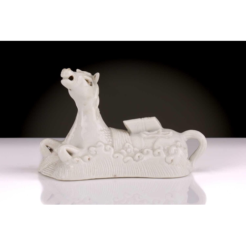 193 - A Chinese Dehua blanc de chine white horse of wisdom, Qing dynasty, 18th century, carrying a Buddhis... 