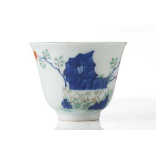 200 - A Chinese porcelain wine cup, painted with blossoming plants and rockwork, six character Guangxu mar... 