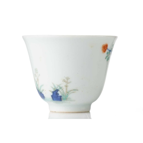 200 - A Chinese porcelain wine cup, painted with blossoming plants and rockwork, six character Guangxu mar... 