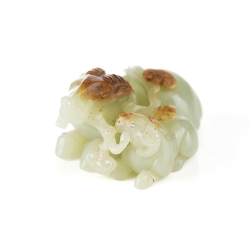 201 - A Chinese jade figure of a ram and its young, in a recumbent pose, each sharing a single stem of lin... 