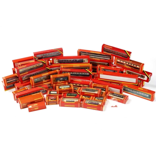 319 - A large quantity of boxed Hornby Railways rolling stock, largely carriages, with some wagons.Appear ... 