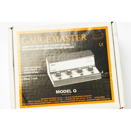 323 - A large quantity of model railway items, to include a boxed Guagemaster Model Q transformer controll... 