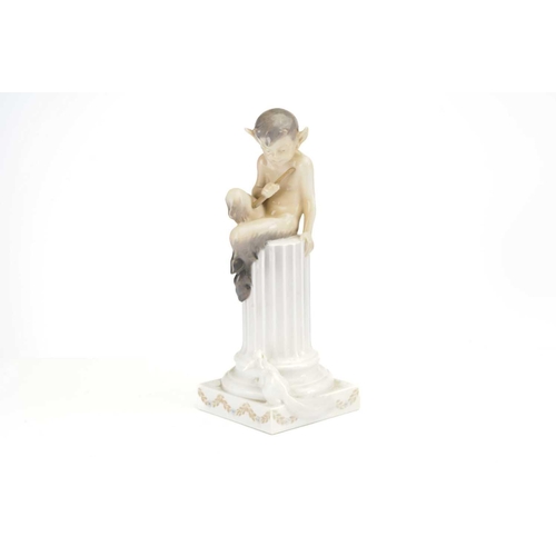 327 - A Royal Copenhagen porcelain figure (No 456) of a young faun seated on a classical column watched by... 