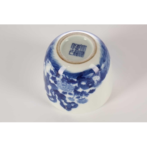 87 - A Chinese blue & white chicken cup, Qing, painted with a boy and chicken between rocks and blossomin... 