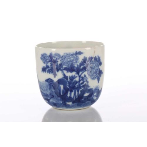 87 - A Chinese blue & white chicken cup, Qing, painted with a boy and chicken between rocks and blossomin... 