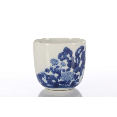 87 - A Chinese blue & white chicken cup, Qing, painted with a boy and chicken between rocks and blossomin... 