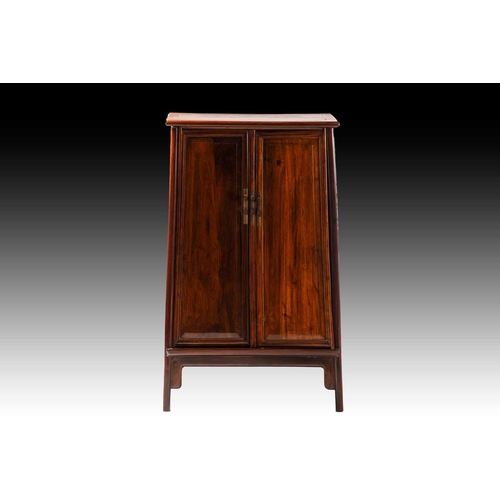 90 - A Chinese Huanghuali tapering two-door cabinet with radiused corners, Qing Dynasty. Each door with f... 