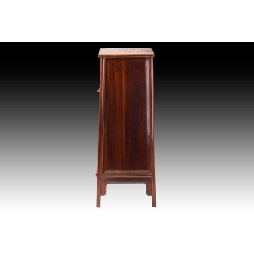 90 - A Chinese Huanghuali tapering two-door cabinet with radiused corners, Qing Dynasty. Each door with f... 