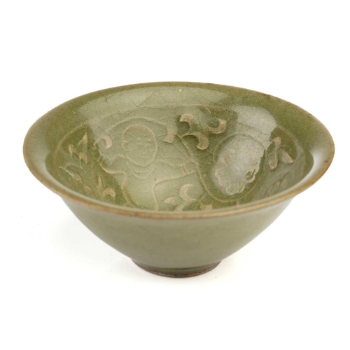 91 - A Chinese Longquan celadon bowl, Song - Yuan dynasty, of shallow conical form, with flower head deco... 