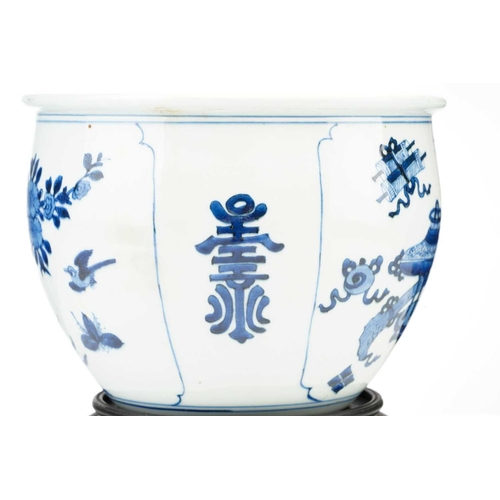 93 - A Chinese blue & white jardiniere, painted with a panel of birds and blossoming tree peony and verso... 