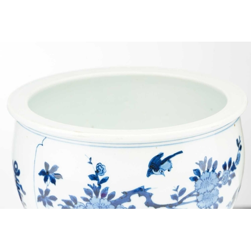 93 - A Chinese blue & white jardiniere, painted with a panel of birds and blossoming tree peony and verso... 