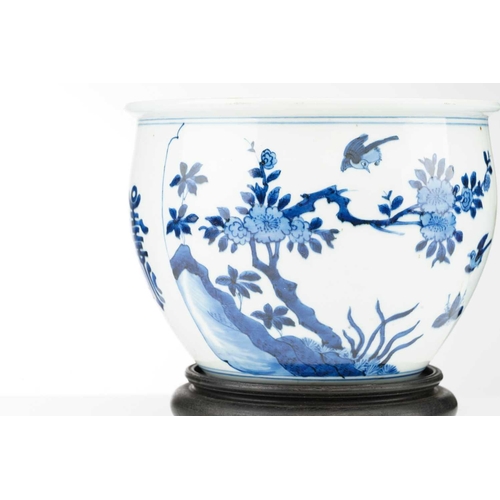 93 - A Chinese blue & white jardiniere, painted with a panel of birds and blossoming tree peony and verso... 